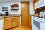 Kitchen is equipped with microwave, dishwasher, stove and cooktop